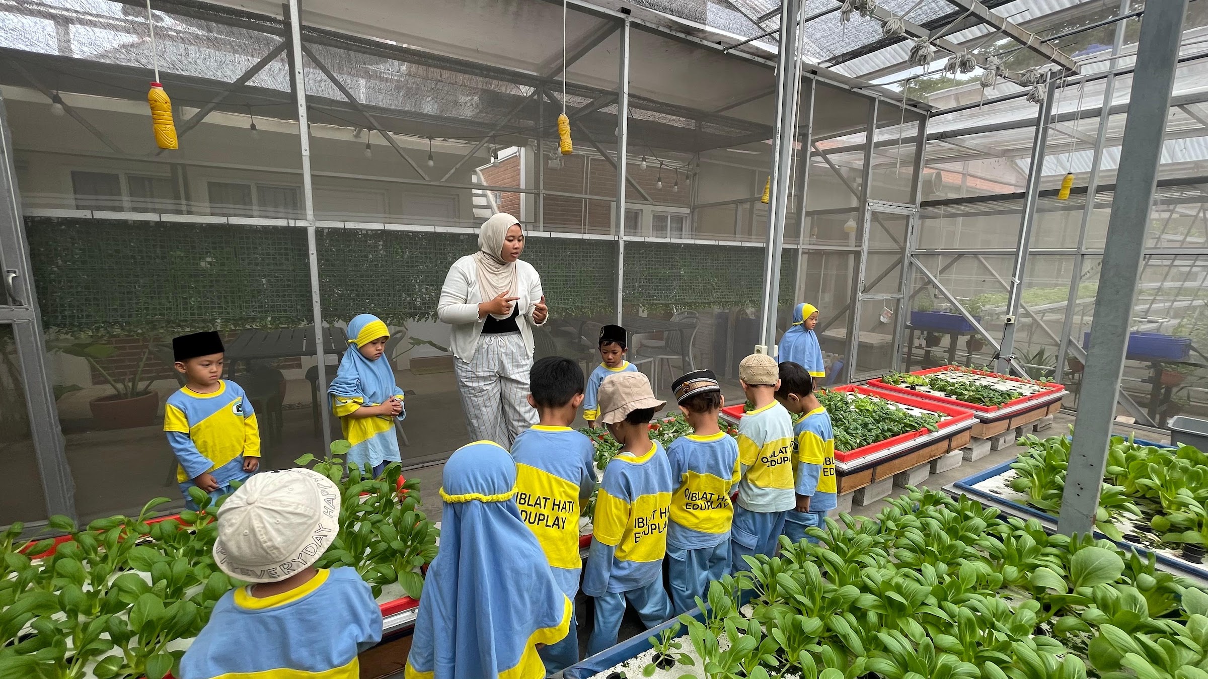 StrawHat Integrated Green Farming outdoor seating surrounded by gardens